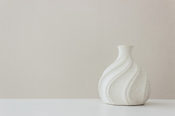 A white vase on the table