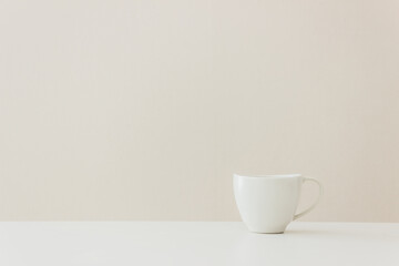 A white cup of coffee on table