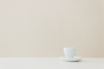 Fototapeta na wymiar A white cup of coffee on table.