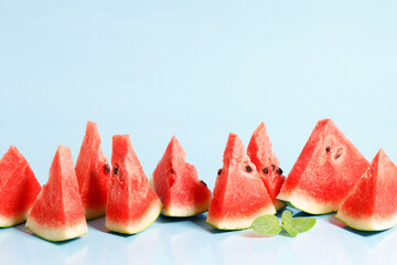 Sliced watermelon on blue background