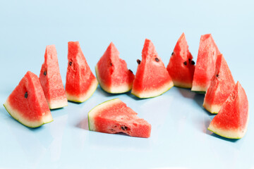 Sliced watermelon on blue background