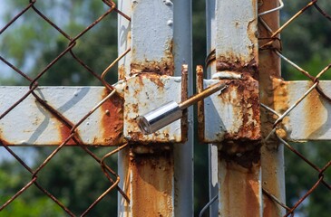 Close up of an old rusty metal padlock, in shalow focus
