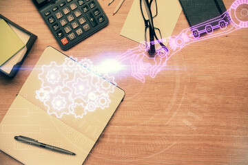 Double exposure of technology theme drawing over work table desktop. Top view. Global data analysis concept.