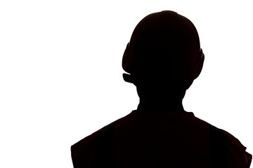 dark silhouette of young engineer in hard hat on white isolated background, building industry concept