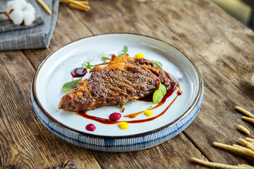 Gourmet grilled beef steak on the wooden table