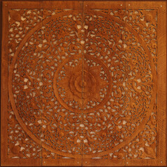 Wood carvings, Thai traditional flower pattern for wall decoration.