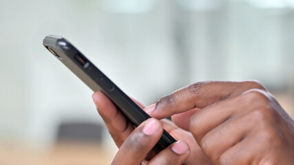 Close Up of African Man Using Smartphone