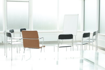 Flipchart chairs in a bright office space. Office training concept
