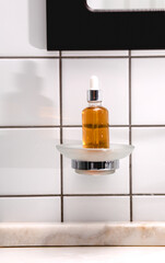 Natural Serum. Concept of cosmetic injection is hyaluronic acid, botulin, serum on the background of tiles in the bathroom