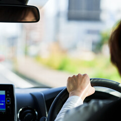 japanese middle aged woman using car navigation system