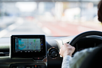 japanese middle aged woman using car navigation system