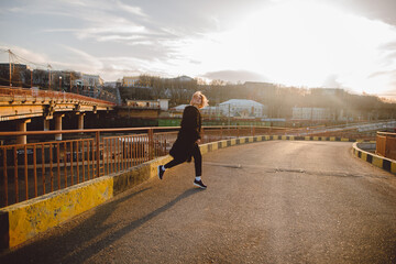 Fototapeta premium Fashion shot of young hipster woman. Urban street style