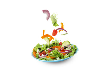 Plate of greek salad and ingredients isolated on white background