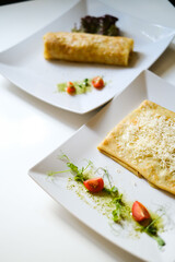 serving pancakes on a white plate