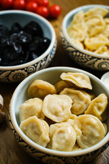 a plate of black and white dumplings