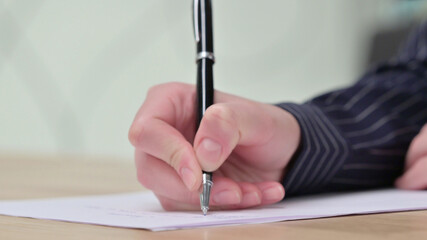 Close up of Female Hand Writing on Paper