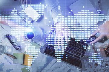 Double exposure of man and woman working together and business theme hologram drawing. Computer background. Top View.