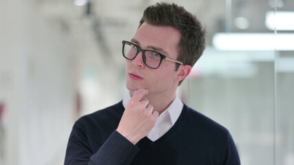 Fototapeta premium Pensive Young Businessman Thinking about Something