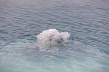 Dead sea salt crystals on the water