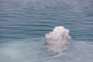 Dead sea salt crystals on the water