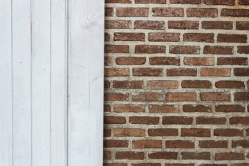 A brick wall  and white wooden background