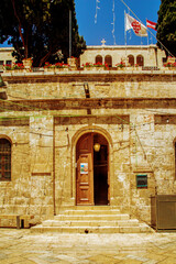 Jerusalem, Israel - 28 April 2021: The entrance to the Austrian Hospice of the Holy Family, a refuge for itinerant pilgrims, was opened in 1854 by the Catholic Church of Austria in the Holy Land.