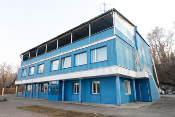 old blue three-story building