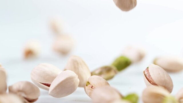 Super Slow Motion Shot of Fresh Roasted Pistachio Nuts