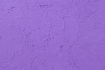 Purple colors textured wall. Plaster surface with amethyst shade. Violet wall.