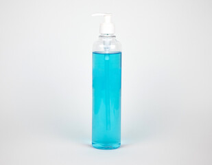 Alcohol, blue gel in a clear plastic bottle. Infection prevention covid19. on white background. 
