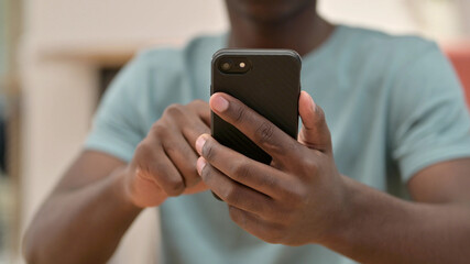 Close Up of African Man Using Smartphone