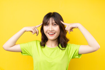 Fototapeta premium Young Asian girl with expressions and gestures on background