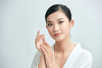 Beautiful woman after shower. Photo of asian woman with perfect makeup on white background. Beauty and skin care concept
