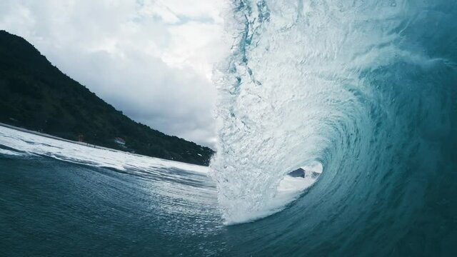 Ocean wave in slow motion. Extreme slow motion (8 times at 29.97 fps) of the barreling ocean wave