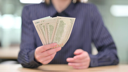 Close up of Businesswoman Offering Dollars, Finance