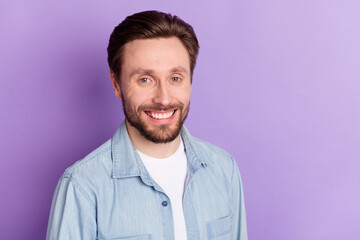 Photo of happy smiling good mood handsome businessman laughing wear denim shirt isolated on purple color background