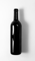 A bottle of red wine on a white background