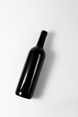 A bottle of red wine on a white background