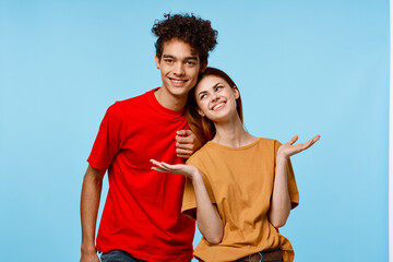 cheerful young couple hugs communication fun fashion