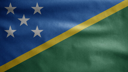 Solomon Islander flag waving in the wind. Salomon Islander banner blowing silk.