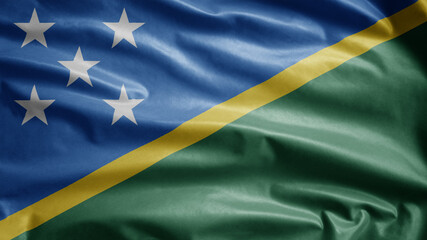 Solomon Islander flag waving in the wind. Salomon Islander banner blowing silk.