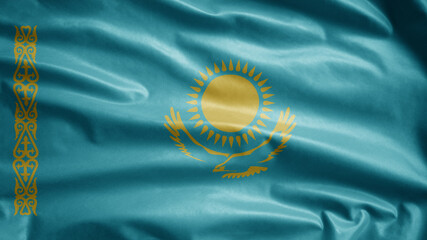 Kazakhstani flag waving in the wind. Kazakhstan banner blowing soft silk.