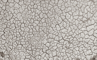 Mudflat cracked desert barren surface for natural background, layer, wallpaper, photo effect. Black and White Monochrome image of drought effects of global warming