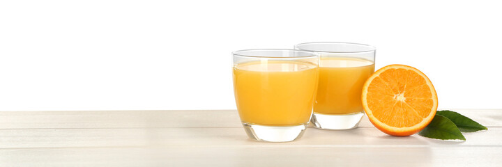 Delicious orange juice and fresh fruit on wooden table against white background. Space for text