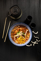 Japanese miso ramen soup on dark background viewed from above. Japanese noodles.