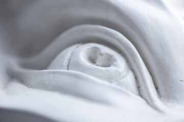 Replica of the sculpture by Michelangelo (Detail of David), white eye looks to the right