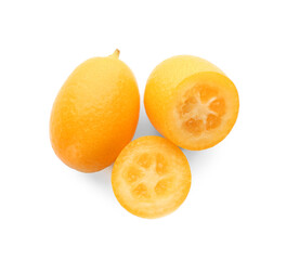 Cut and whole fresh kumquats on white background, top view