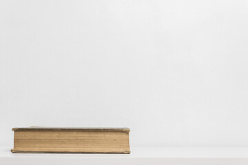 A book on table over the light wall