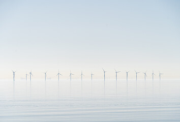 Offshore wind turbines generating renewable electricity and energy off the Essex clacton coast for...