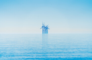 Offshore wind turbines generating renewable electricity and energy off the Essex clacton coast for...